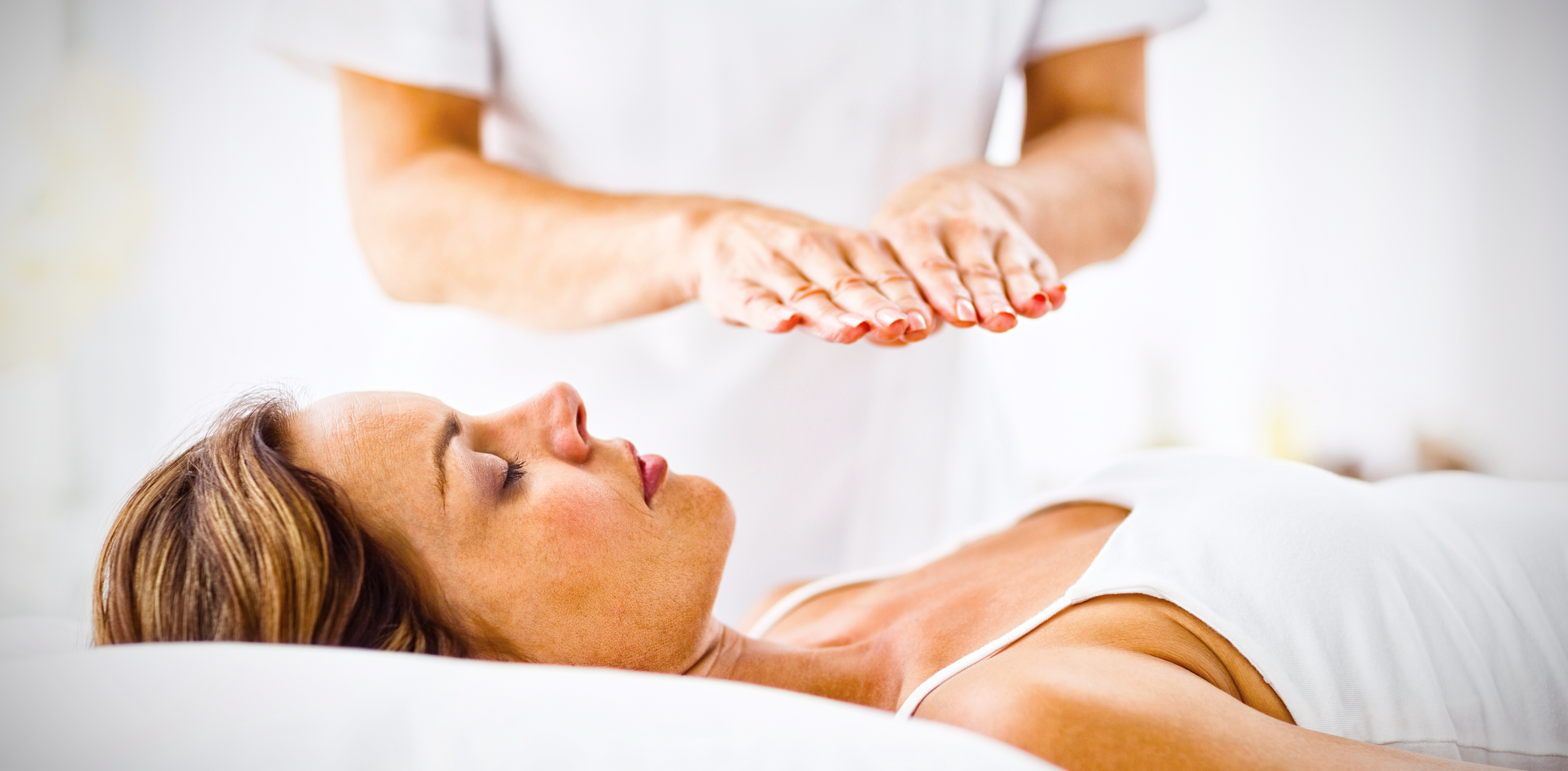 young-woman-receiving-reiki-treatment